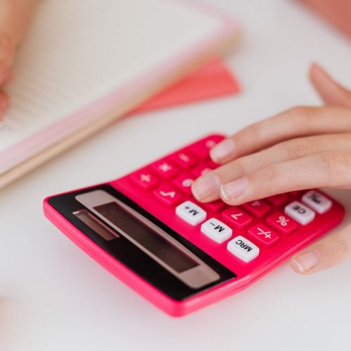 close up of a girl using a calculator